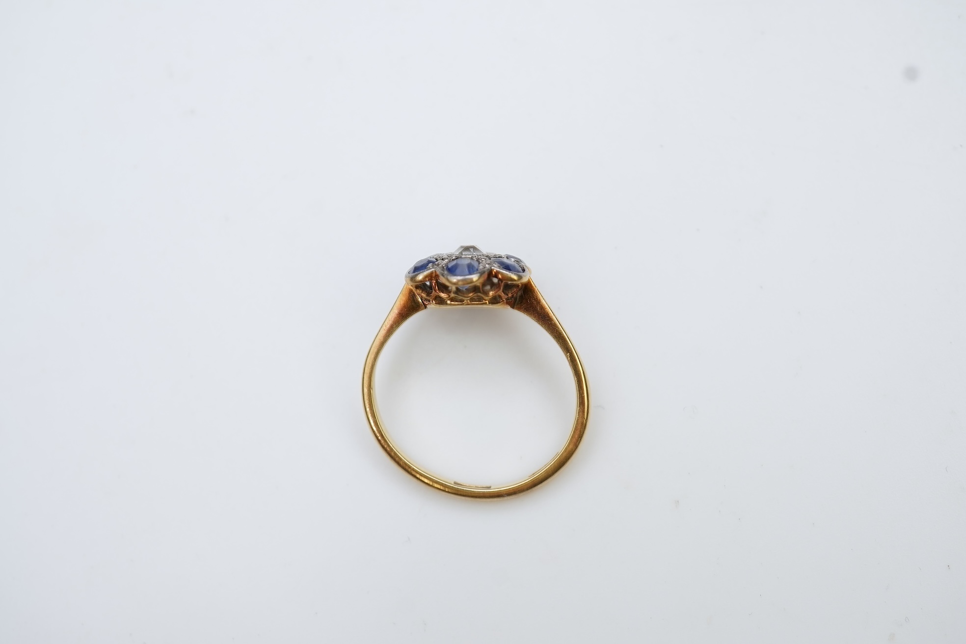 A sapphire and diamond cluster ring, early 20th century